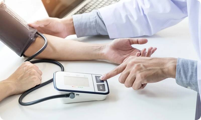 a person's hand touching a device with a stethoscope